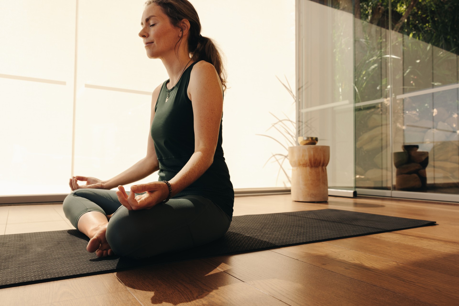 Senior woman practicing yoga at home